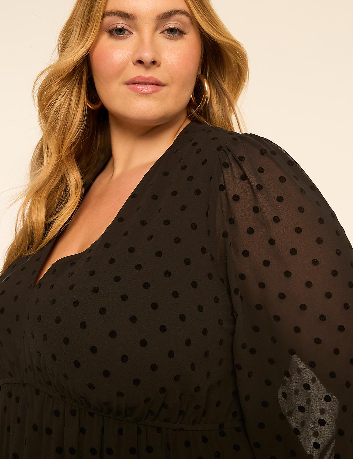 A woman with blonde hair and hoop earrings wears a black polka dot dress against a plain background. Product Image 3