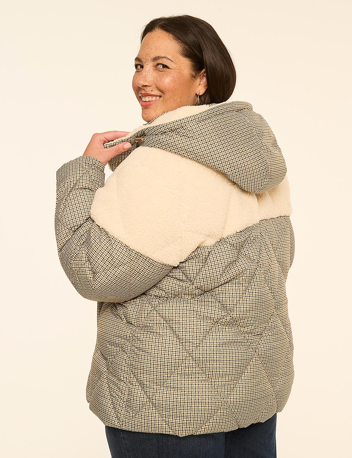 A woman in a patterned puffer jacket smiles over her shoulder against a plain, light-colored background. Product Image 2