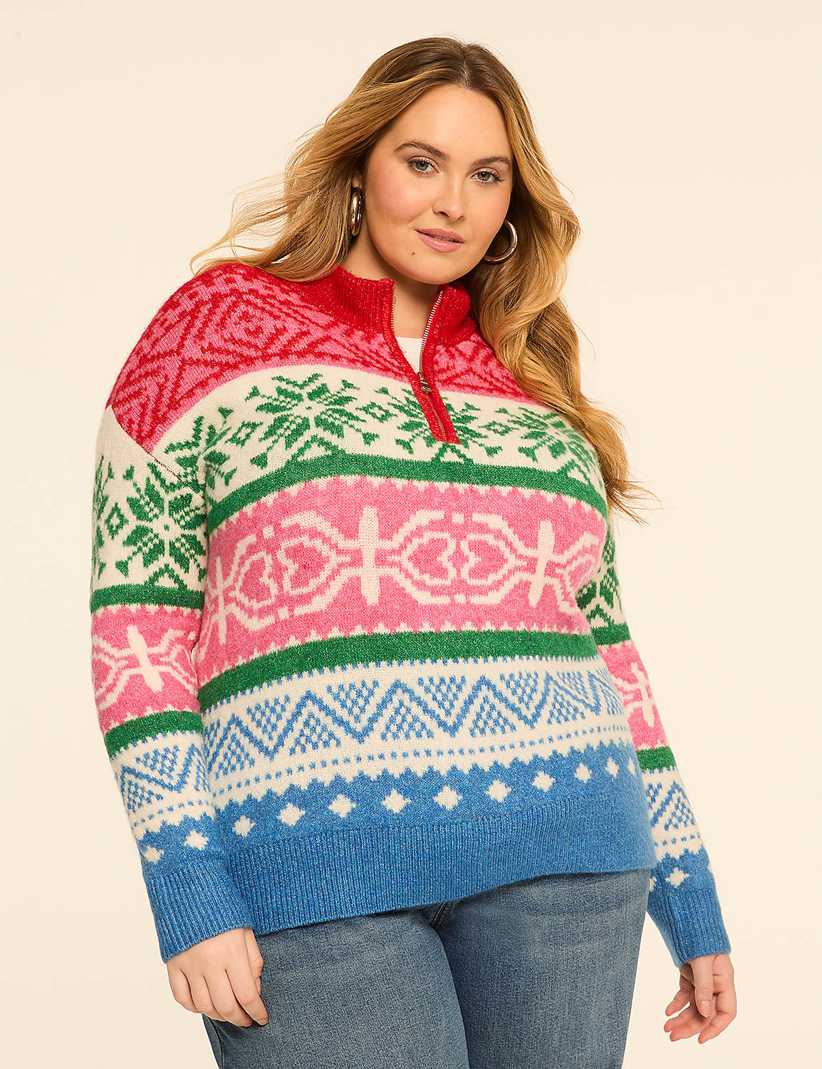 A woman in a colorful, patterned sweater stands against a plain, light-colored background. Product Image 1
