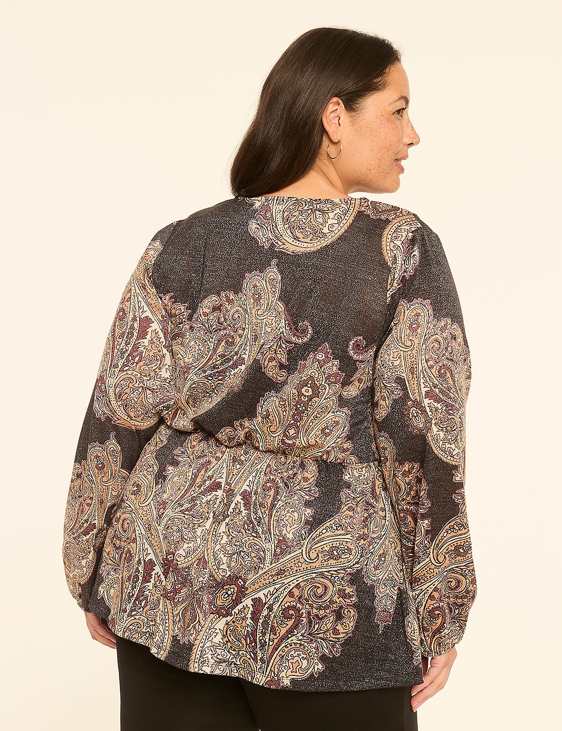 A woman in a paisley-patterned blouse stands against a plain, light-colored background. Product Image 2
