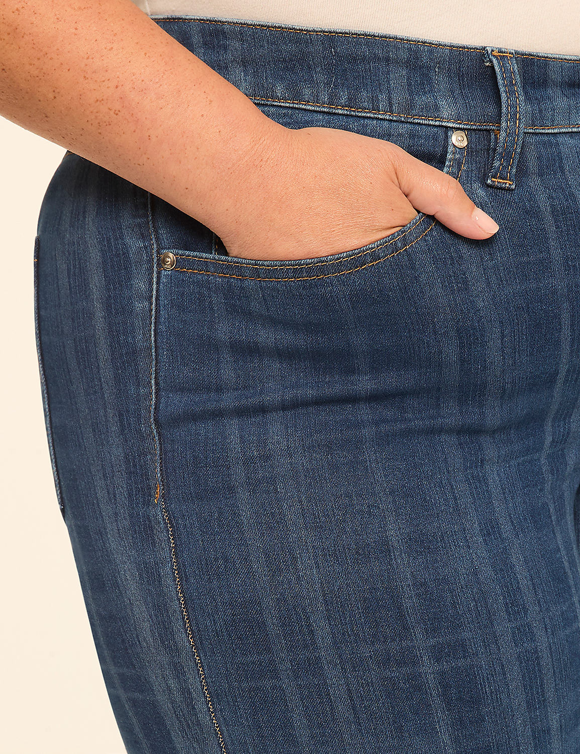 A hand rests in the pocket of dark blue, vertically striped jeans against a plain, light background. Product Image 4