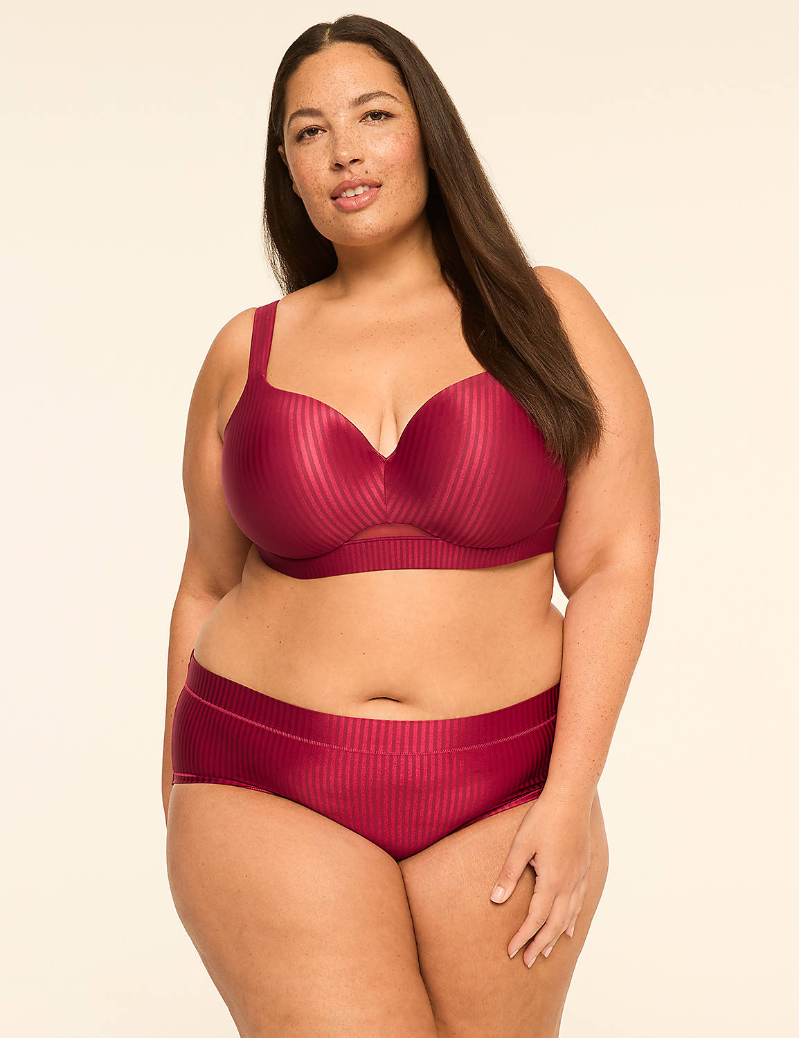 A woman in a burgundy bra and matching underwear stands against a plain, light-colored background. Product Image 4