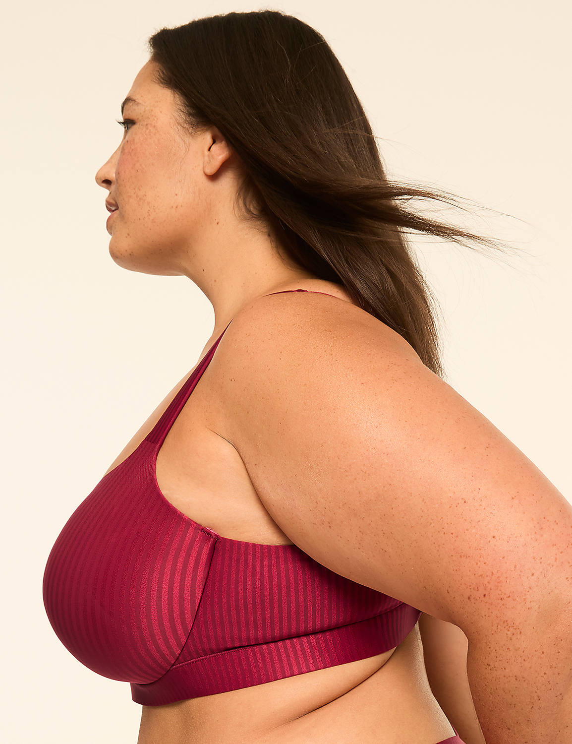 A woman in a maroon ribbed bra is shown in profile against a plain, light-colored background. Product Image 3