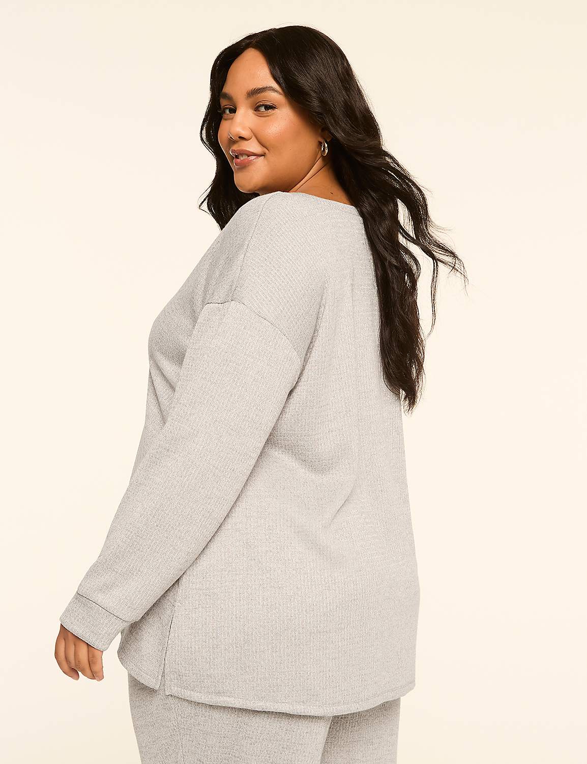A woman in a grey waffle-knit top and pants poses against a plain, light-colored background. Product Image 2