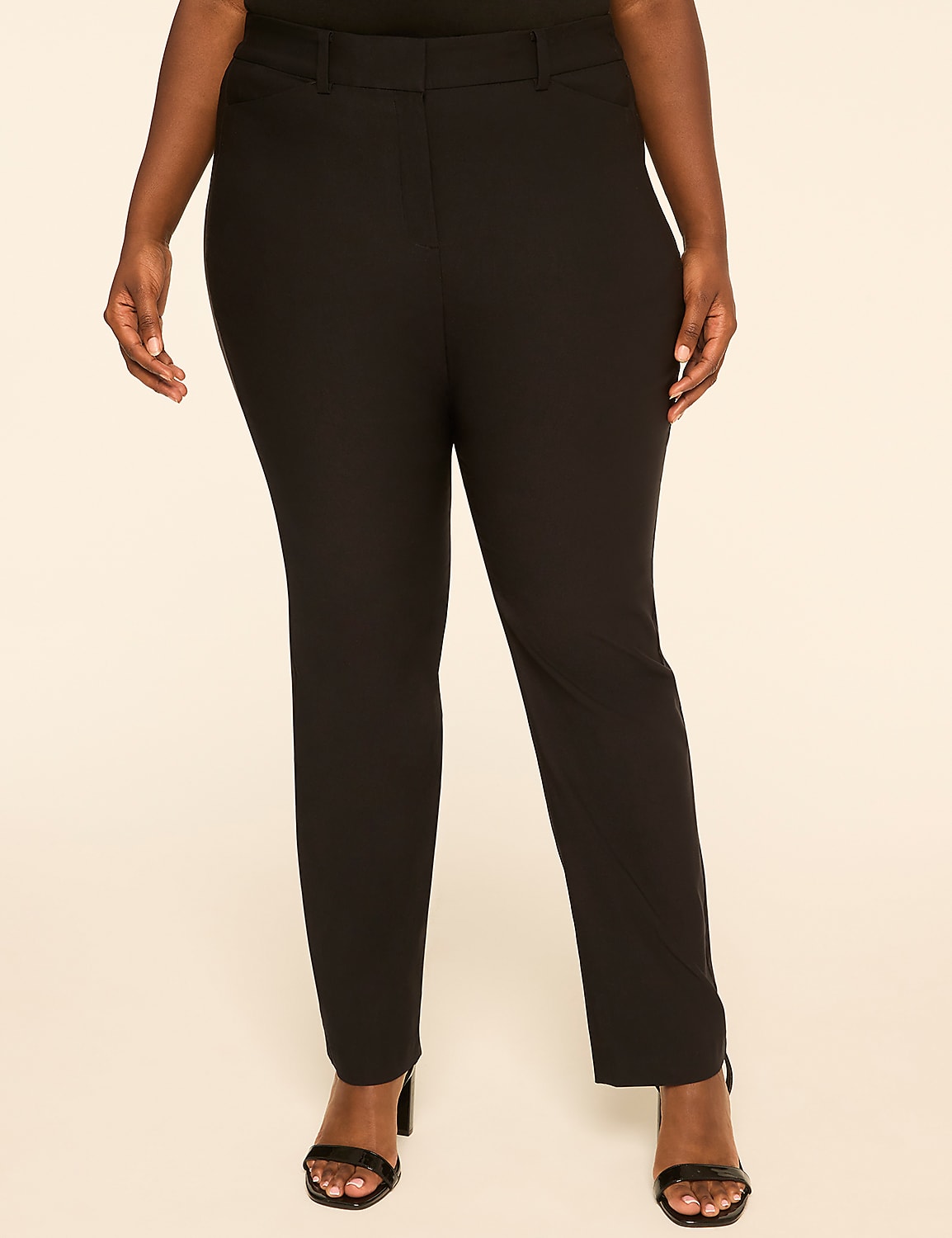 A person stands in black pants and heels against a plain, light-colored background. Product Image 1