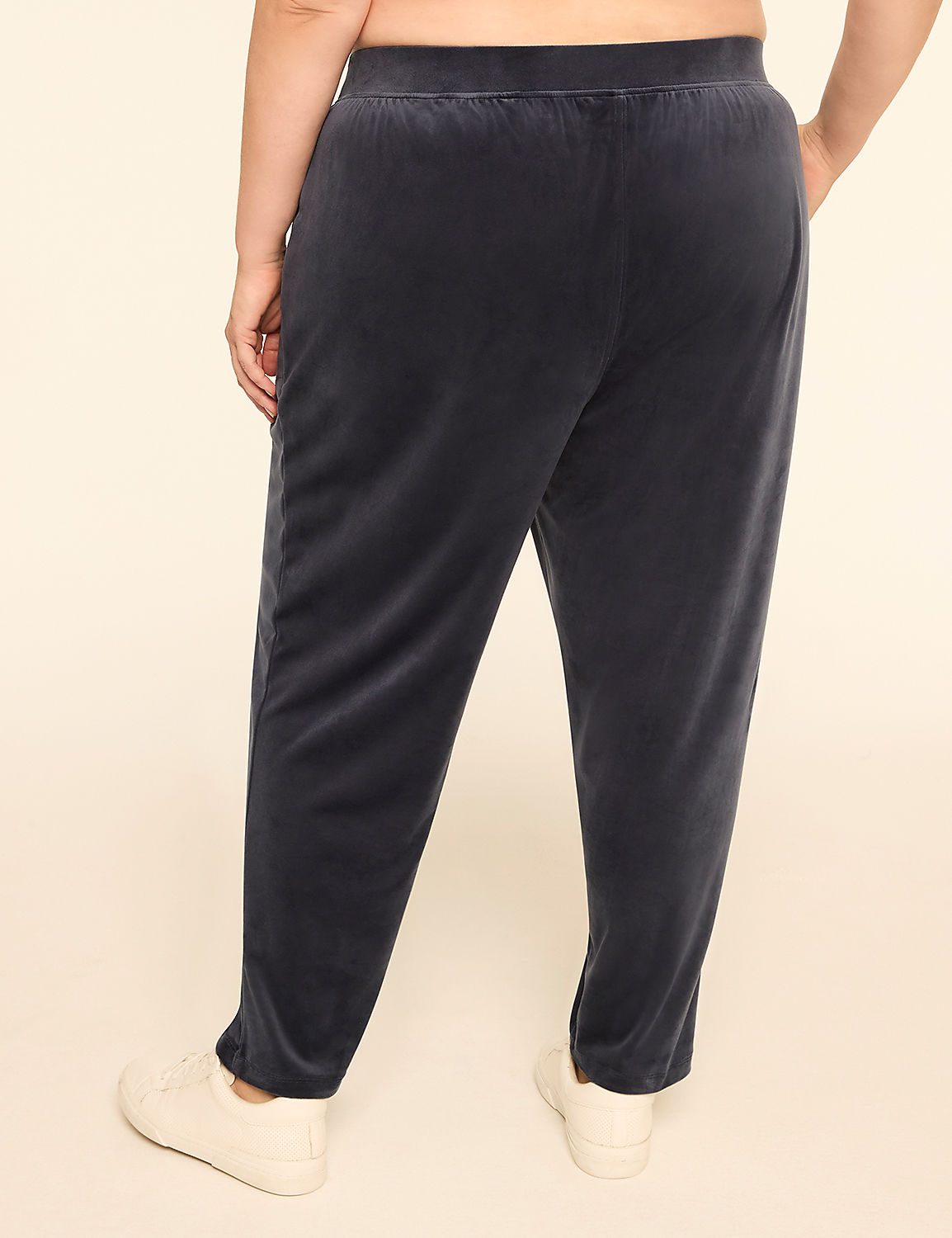 A person wearing dark blue velvet pants and white sneakers stands against a plain, light-colored background. Product Image 2