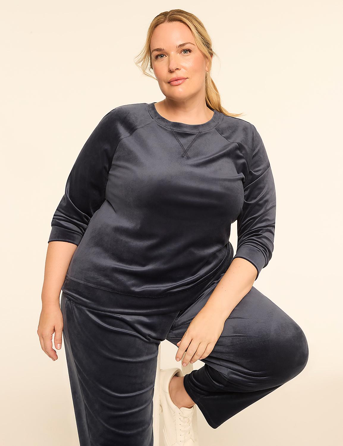 A woman in a navy velvet tracksuit poses against a plain, light-colored background. Product Image 3