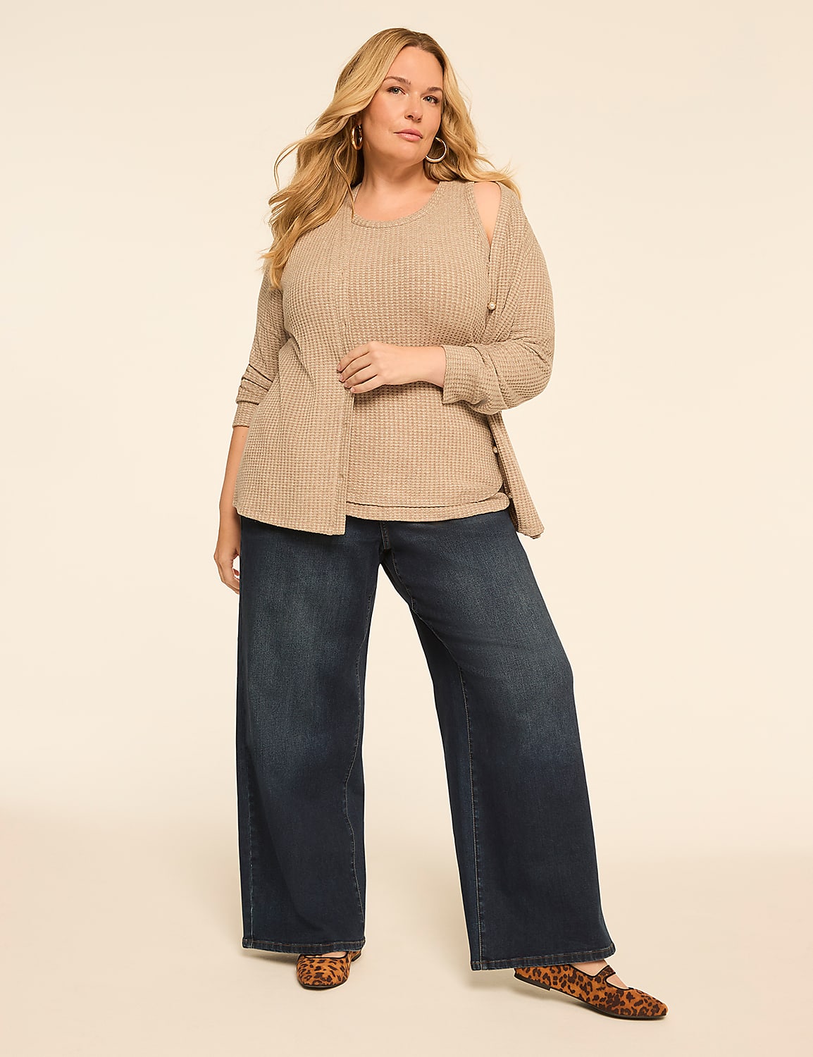 A plus-size woman in a beige top and wide-leg jeans stands against a plain, light-colored background. Product Image 3