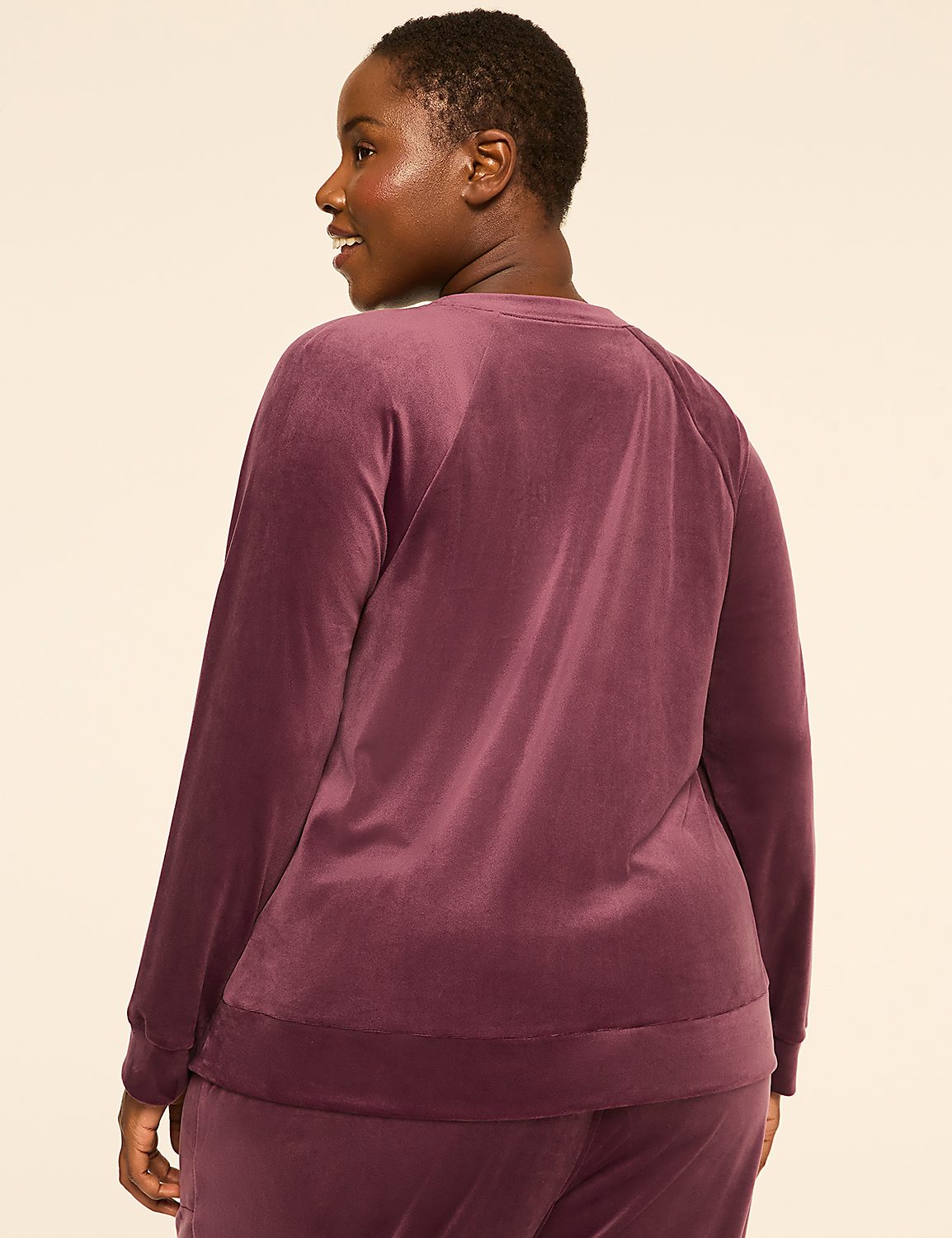 A woman in a plum-colored velour sweatshirt and pants stands against a plain, light-colored background. Product Image 2