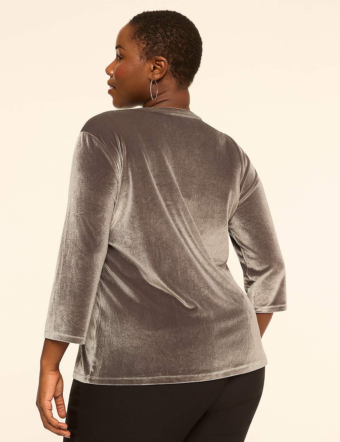 A woman in a gray velvet top and black pants stands against a plain, light-colored background. Product Image 2