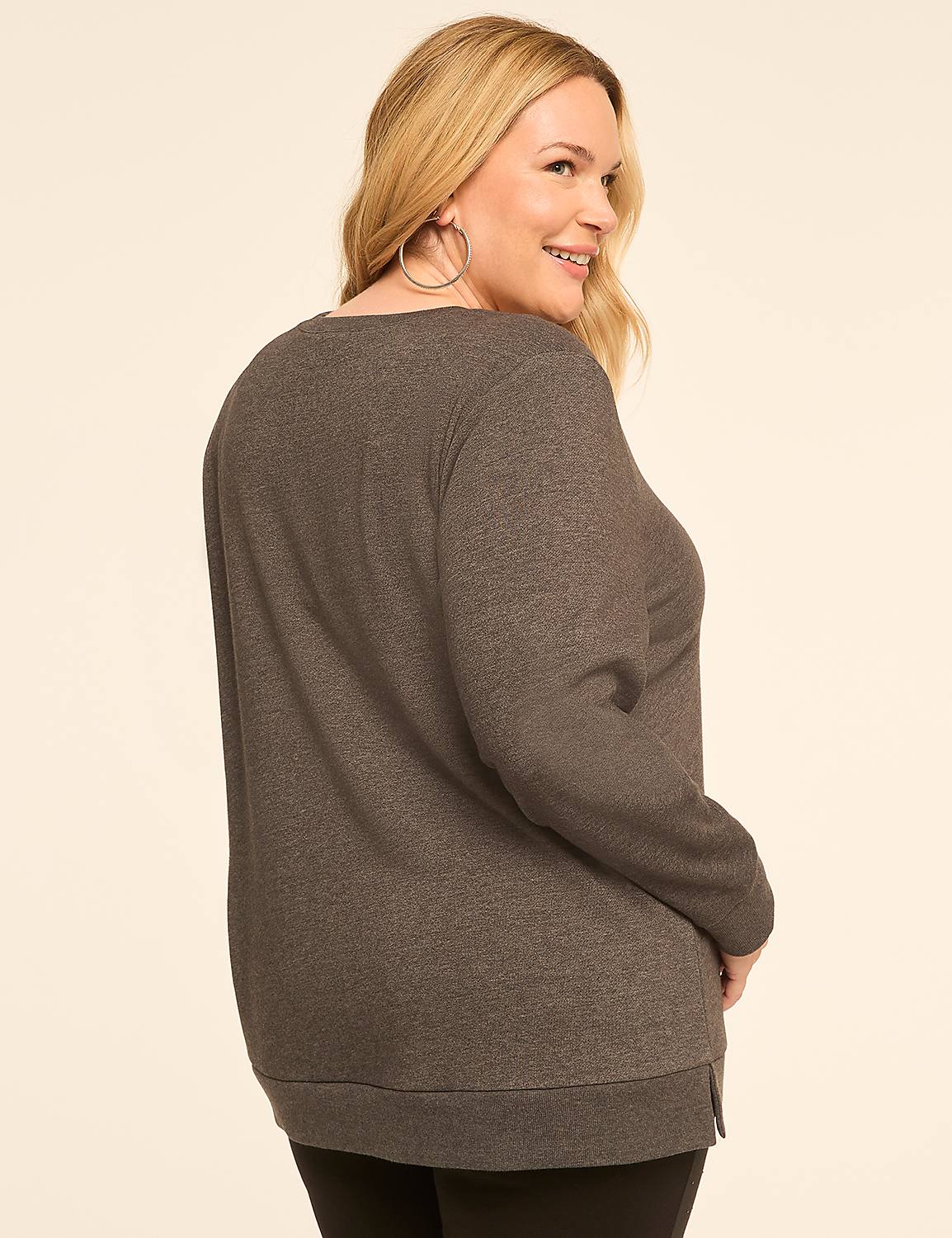 A woman in a gray sweatshirt and black leggings smiles over her shoulder against a plain, light-colored background. Product Image 2