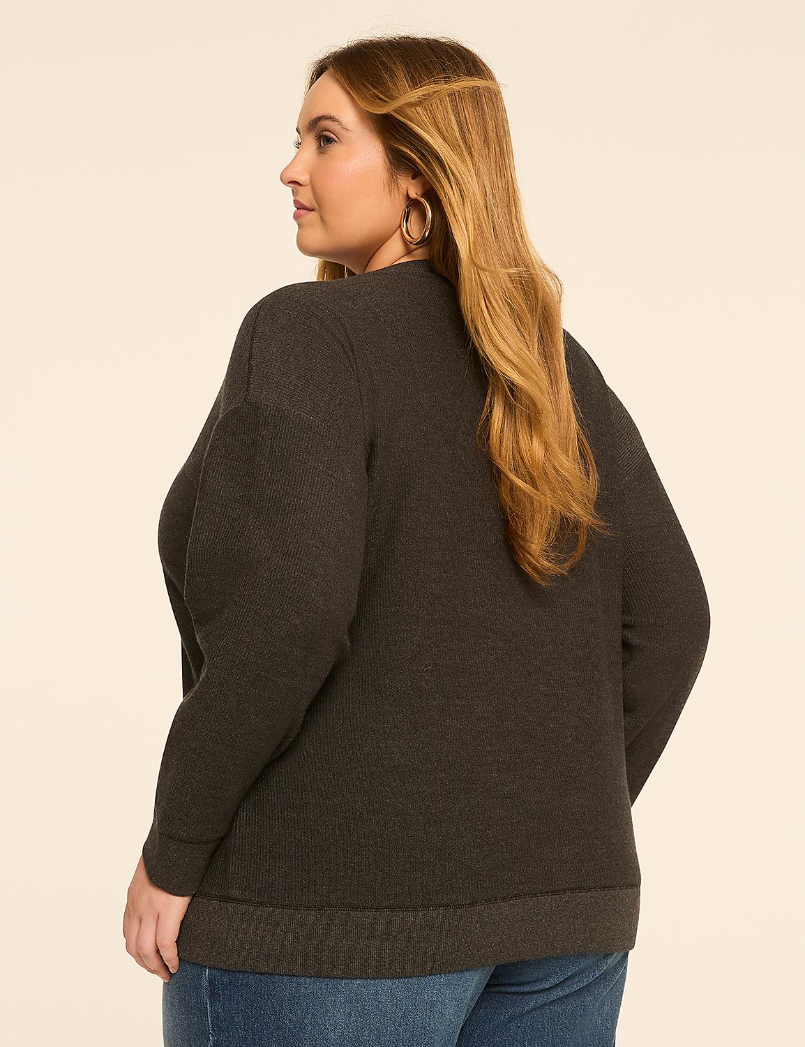 A woman in a dark gray sweater and blue jeans stands against a plain, light-colored background. Product Image 2