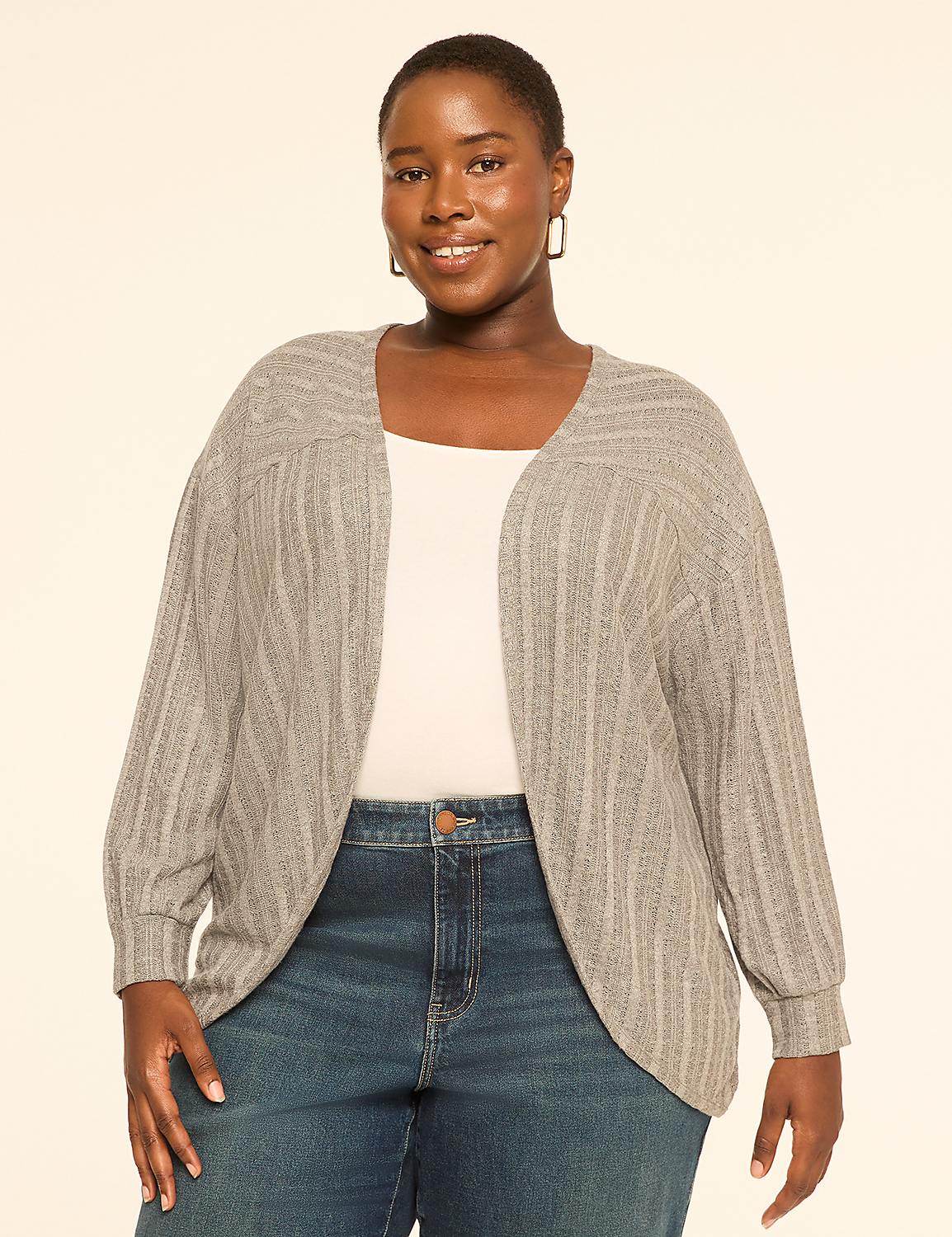 A smiling woman in a gray cardigan and blue jeans stands against a plain, light-colored background. Product Image 1
