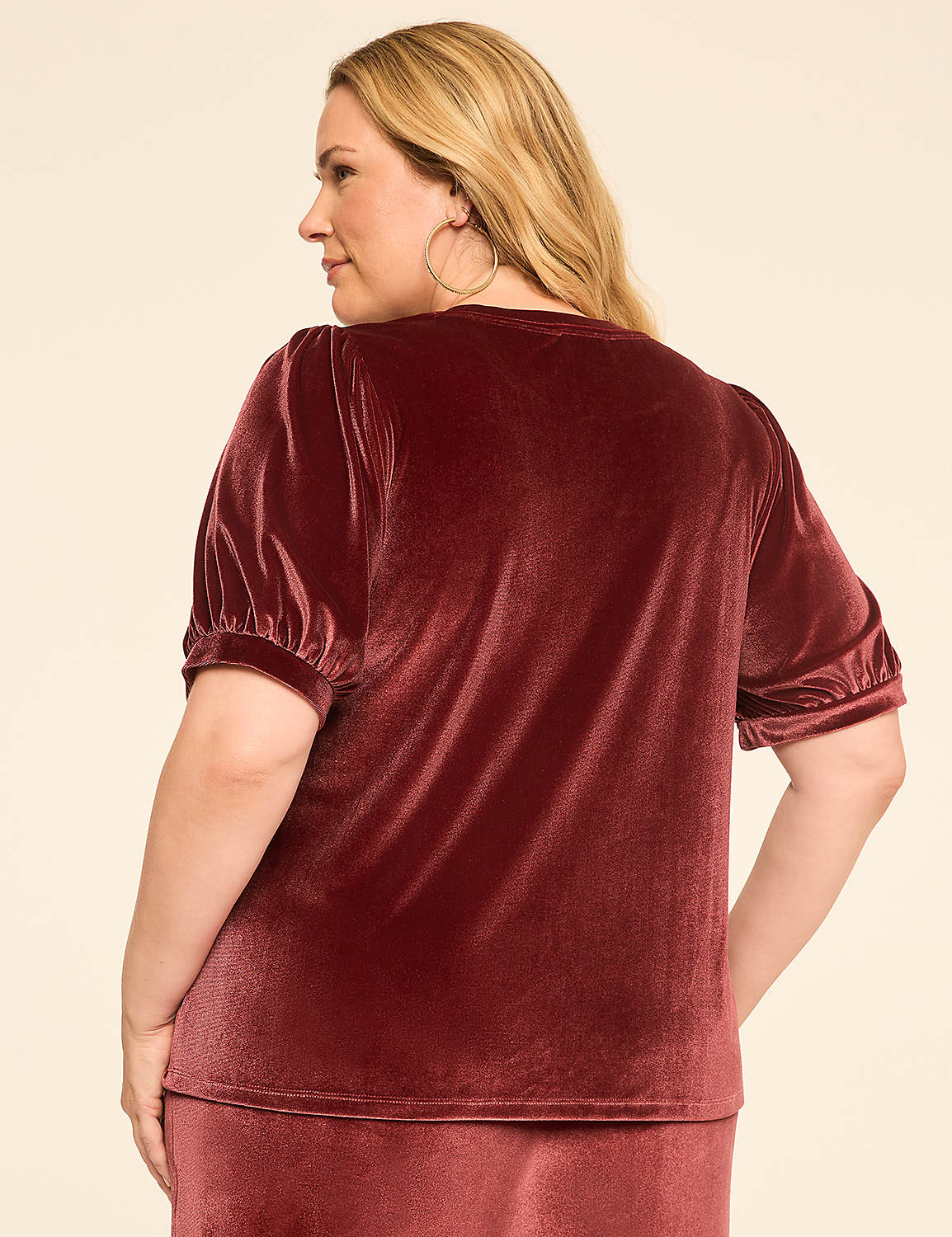 A woman in a velvet top and skirt stands against a plain, light background. Product Image 2