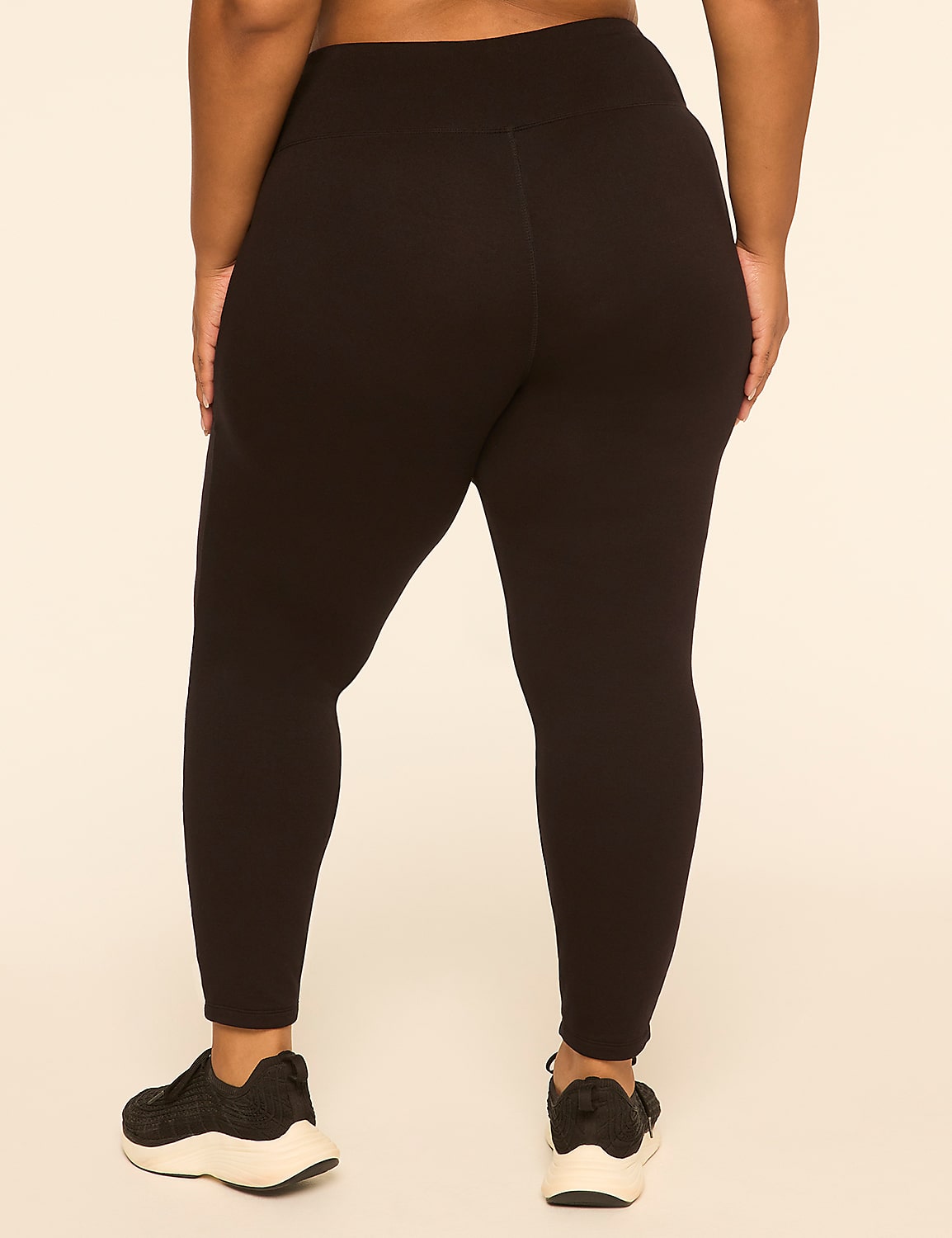 A person wearing black leggings and sneakers stands against a plain, light-colored background. Product Image 2