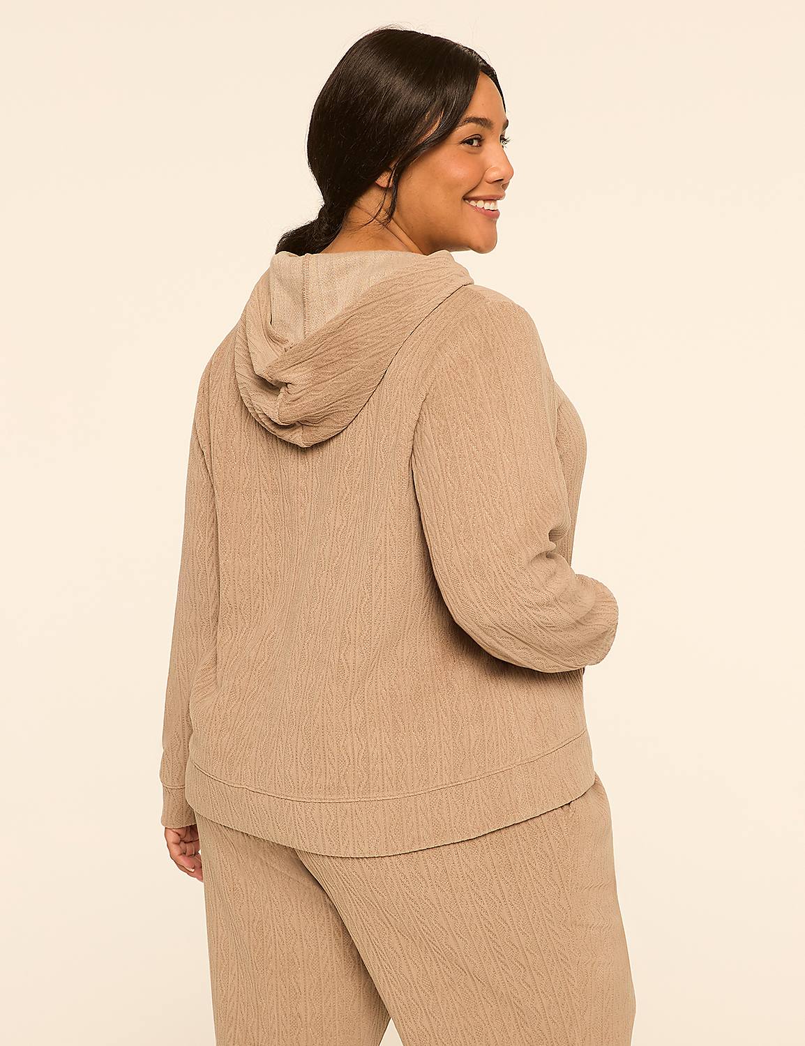 A woman in a tan hoodie and pants stands against a plain, light background. Product Image 2