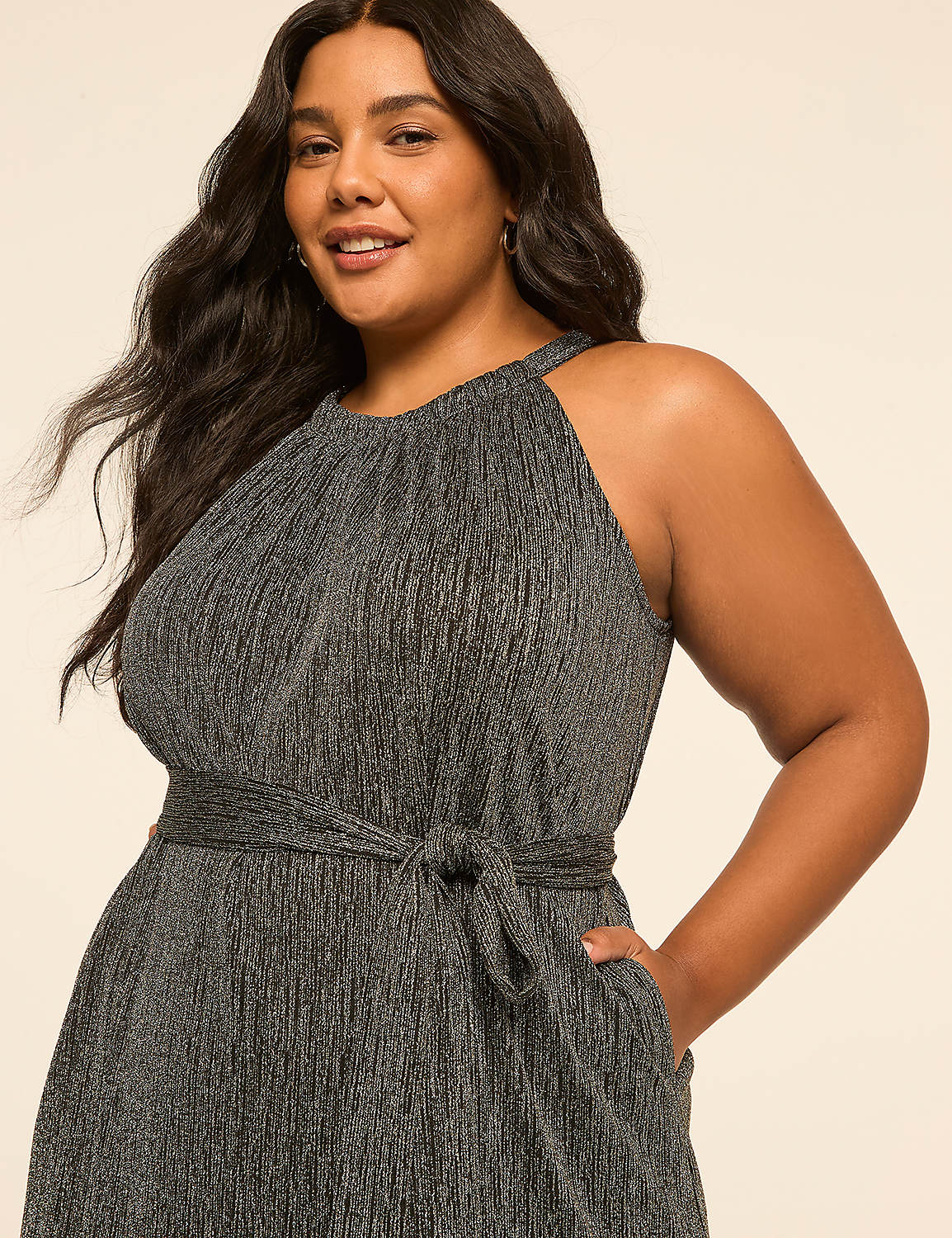 A woman in a sparkly silver dress with a cinched waist stands against a plain, light-colored background. Product Image 3