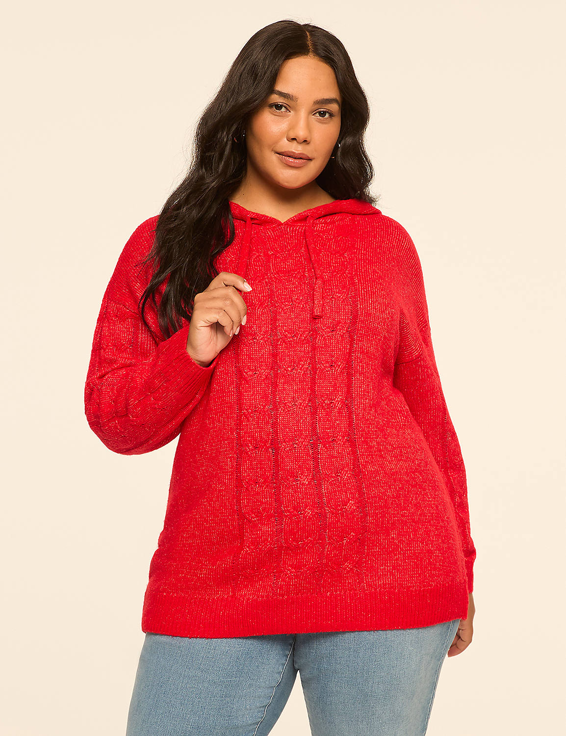 A woman in a red cable-knit hoodie stands against a plain, light-colored background. Product Image 1