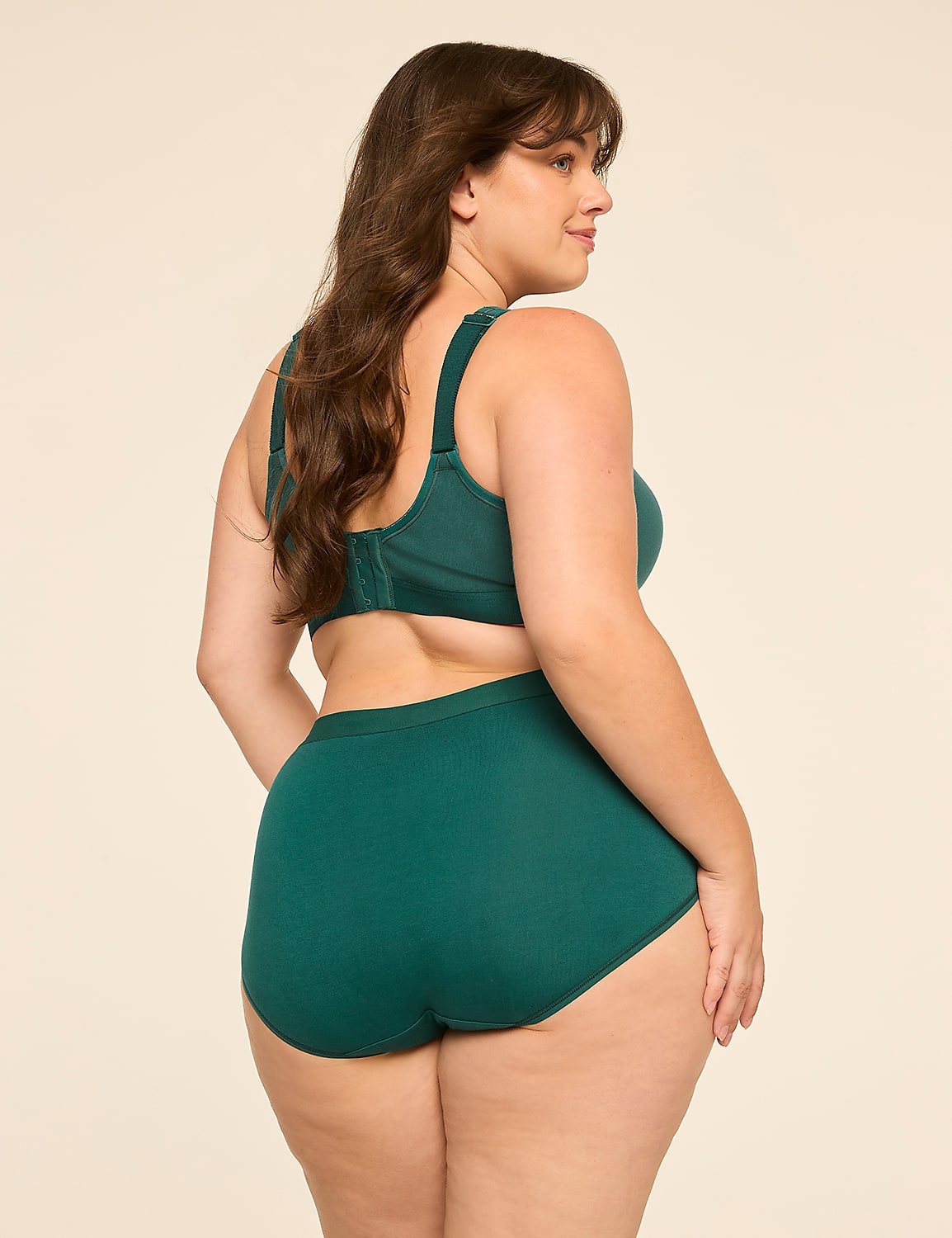 A woman in teal lingerie stands against a plain, light-colored background. Product Image 2