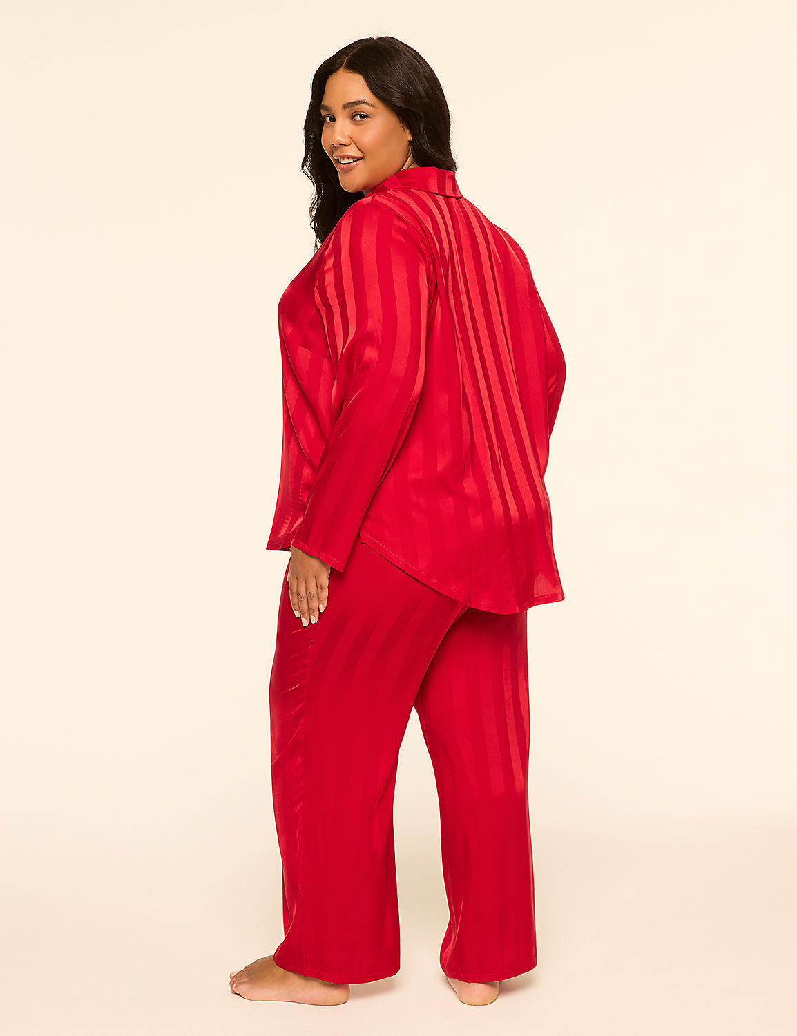 A woman in red striped pajamas stands against a plain, light-colored background. Product Image 2