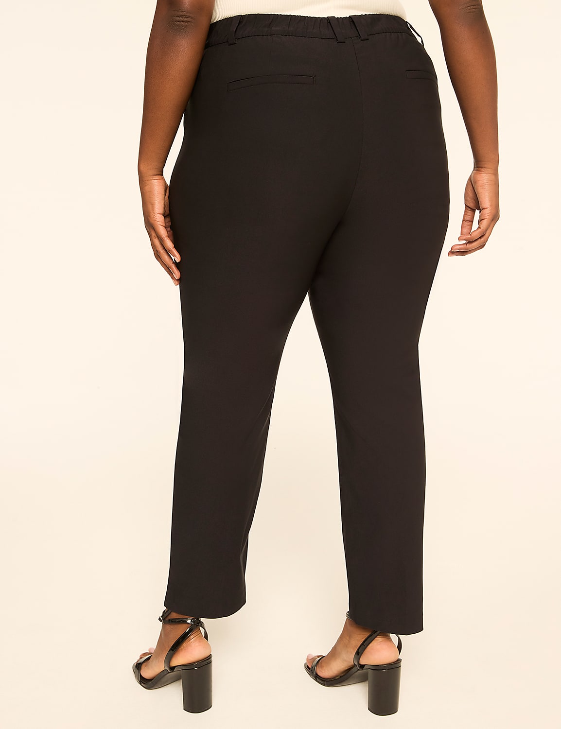 A person wearing black pants and heels stands against a plain, light-colored background. Product Image 2
