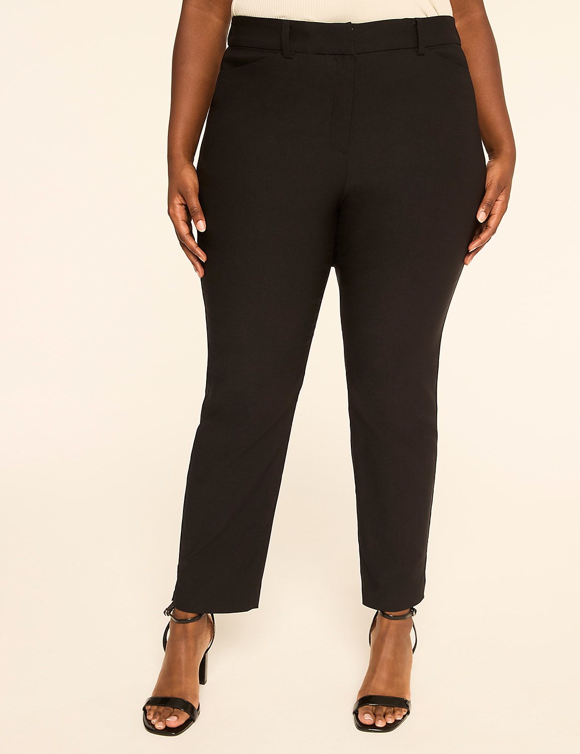 A person wearing black pants and strappy heels stands against a plain, light-colored background. Product Image 1