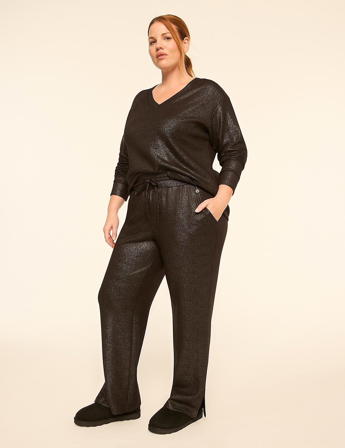 A woman in a sparkly black v-neck top and matching pants stands against a plain, light-colored background. Product Image 3
