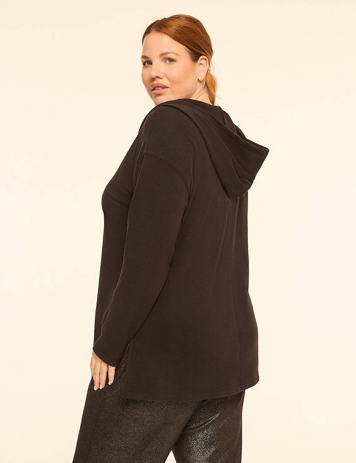 A woman in a black hooded top and sparkly pants stands against a plain, light-colored background. Product Image 2