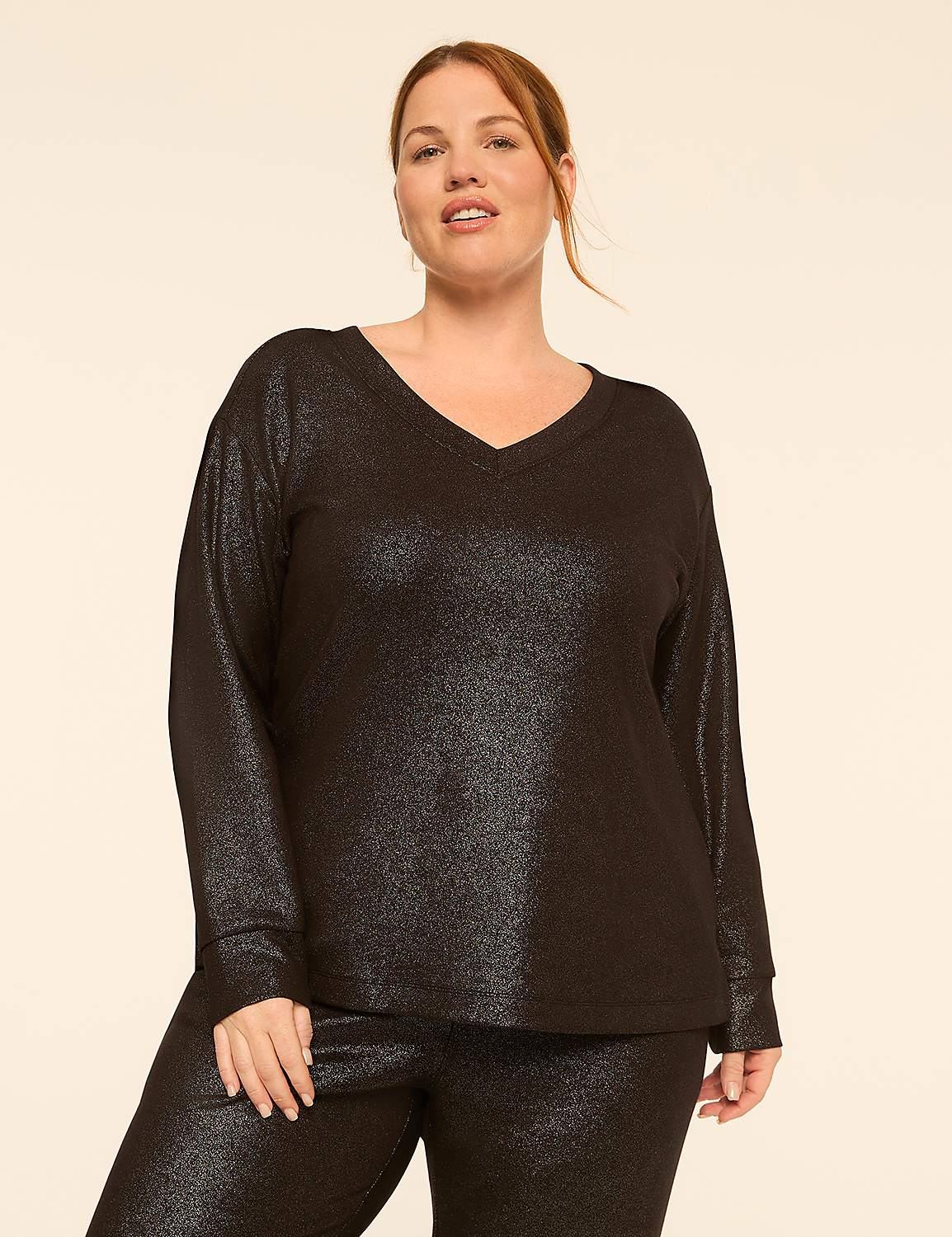 A woman in a sparkly black v-neck top and matching pants stands against a plain, light-colored background. Product Image 1