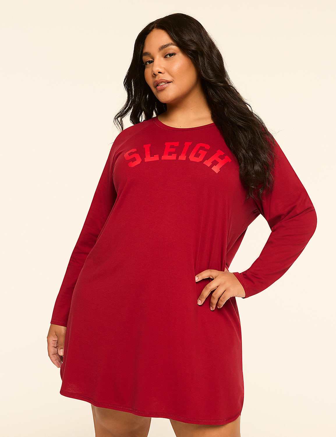 A woman in a red "Sleigh" nightgown stands against a plain, light-colored background. Product Image 1