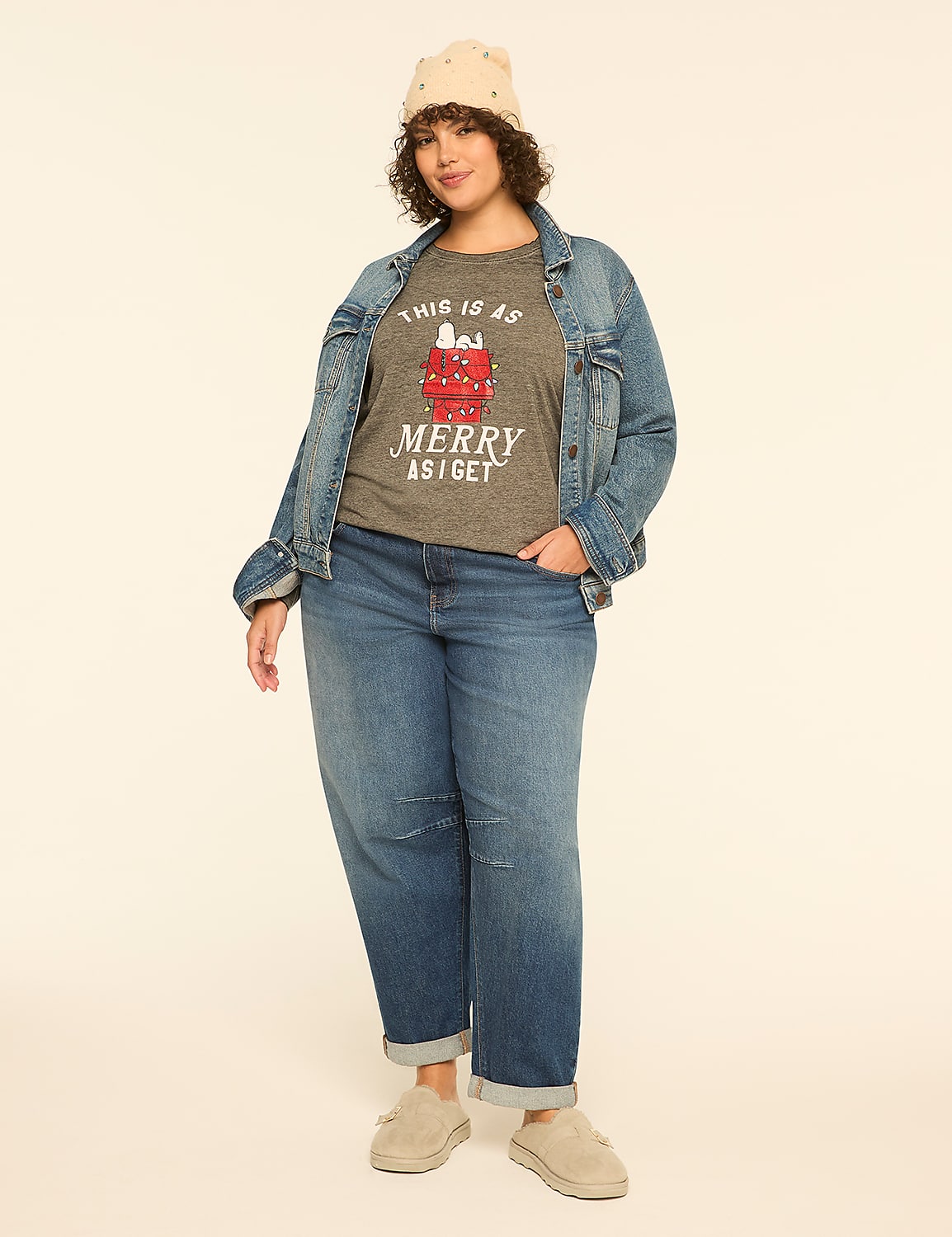 A woman in a festive t-shirt, denim jacket, and jeans stands against a plain, light-colored background. Product Image 3