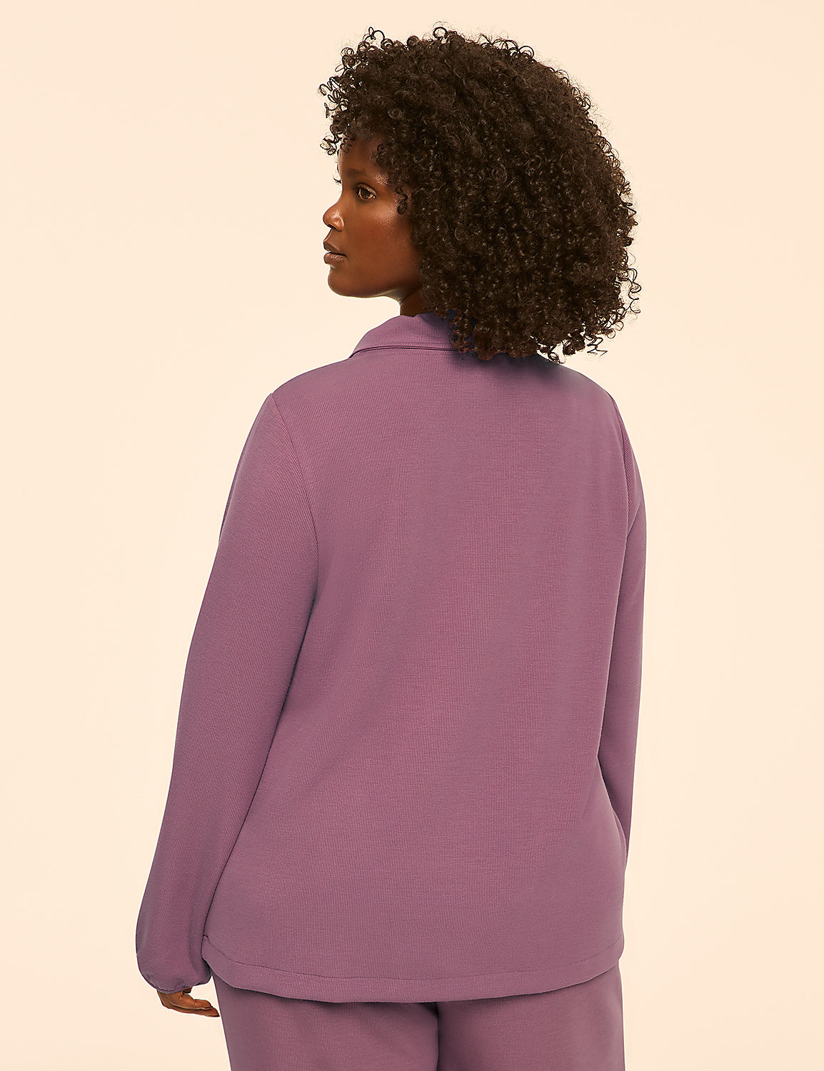 A woman in a pink collared shirt and pants stands against a plain, light-colored background. Product Image 2