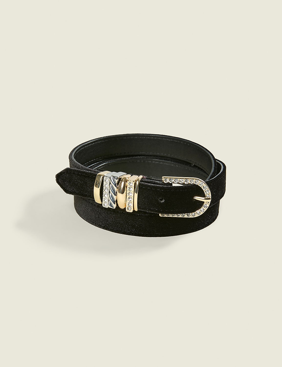 A black velvet belt with a gold-tone buckle and decorative metallic accents rests on a plain, light-colored background. Product Image 1