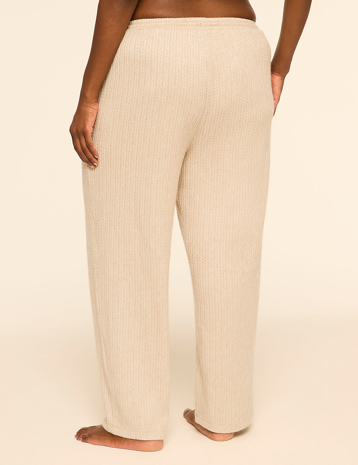 A person wearing beige ribbed lounge pants stands against a plain, light-colored background. Product Image 2