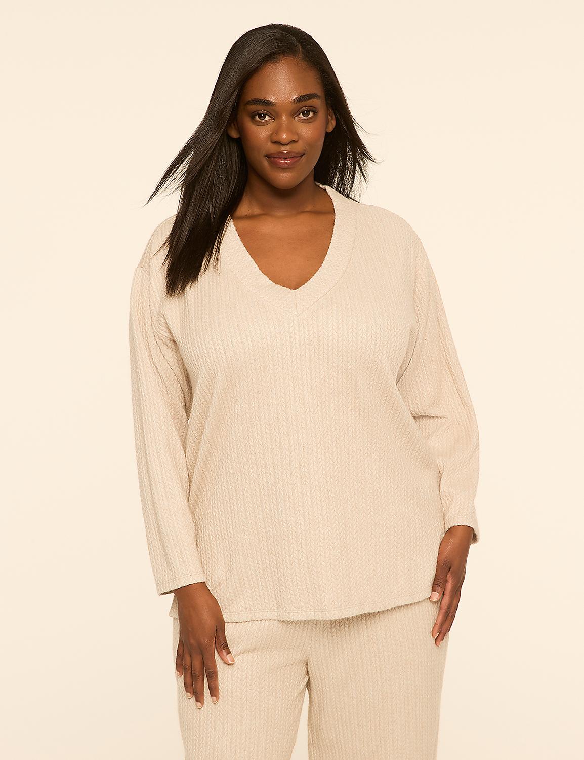 A woman wearing a beige ribbed lounge set stands against a plain, light-colored background. Product Image 1