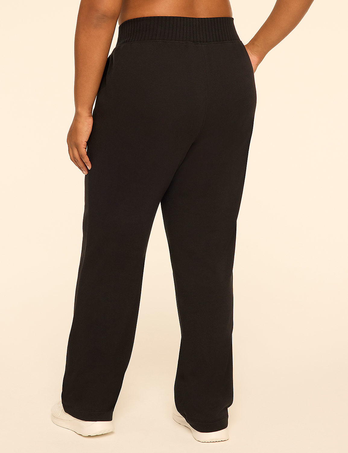 A person wearing black wide-leg pants and white sneakers stands against a plain, light-colored background. Product Image 2