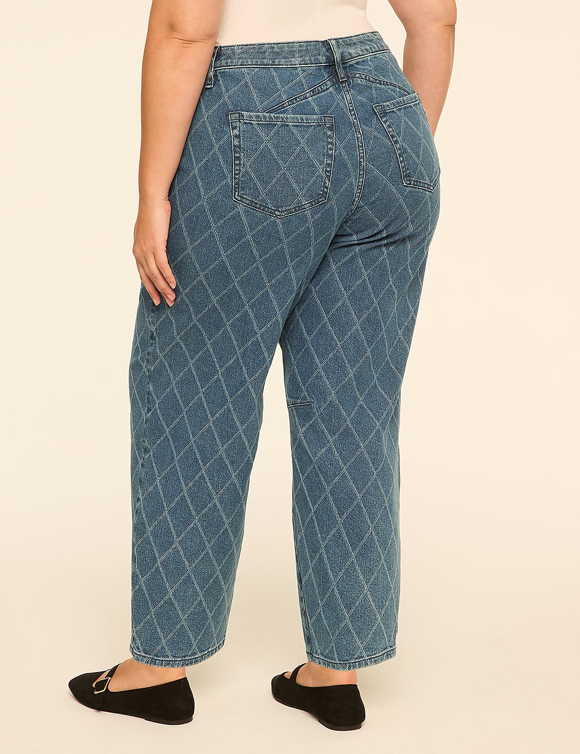 A person wearing blue diamond-patterned jeans and black flats stands against a plain, light-colored background. Product Image 2