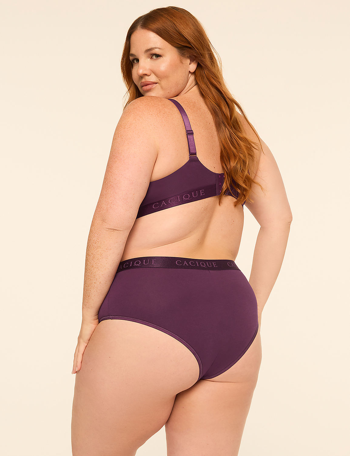 A woman with red hair wearing a purple lingerie set poses against a plain, light-colored background. Product Image 2