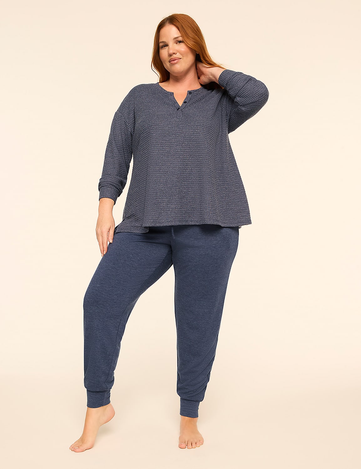 A woman wearing a blue two-piece pajama set stands against a plain, light-colored background. Product Image 3
