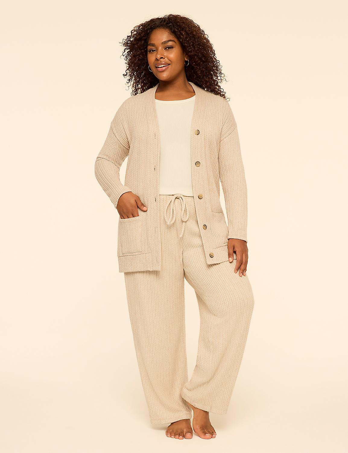 A woman with curly hair wearing a beige knit cardigan and matching wide-leg pants stands against a plain, light-colored background. Product Image 3