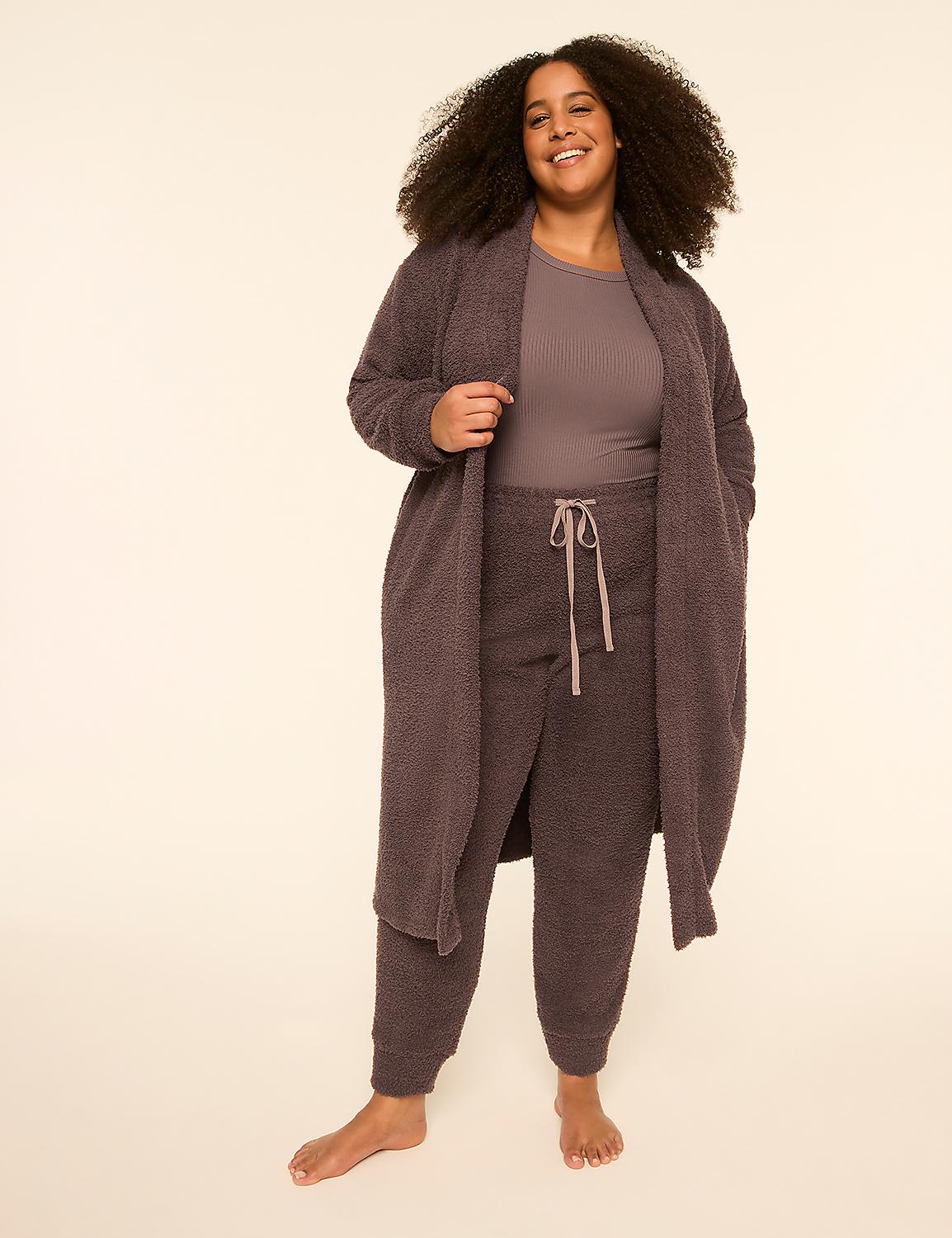 A smiling woman with curly hair wears a mauve-colored lounge set and long robe against a plain, light-colored background. Product Image 1