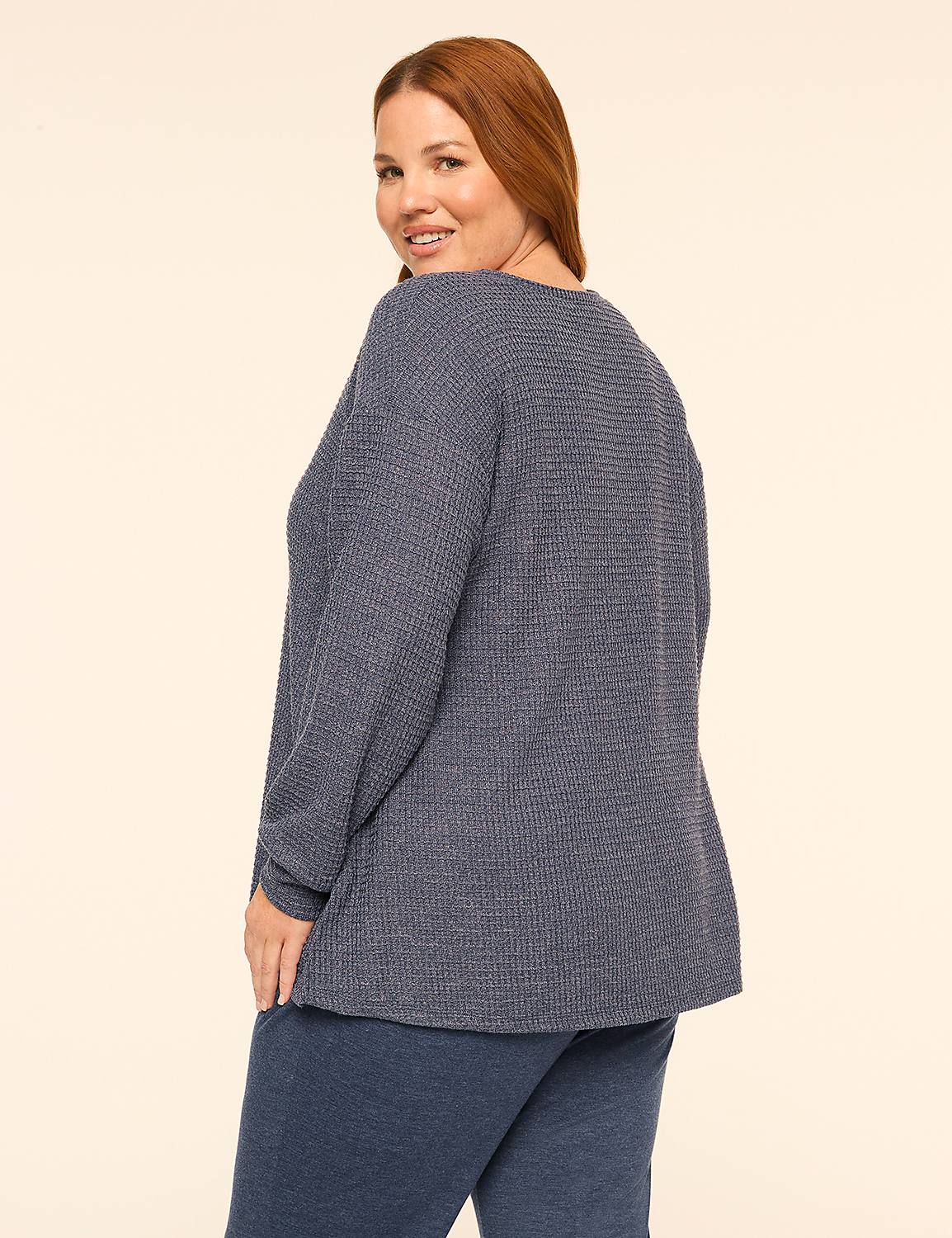 A woman with red hair wearing a blue textured long-sleeve top and matching pants stands against a plain, light-colored background. Product Image 2