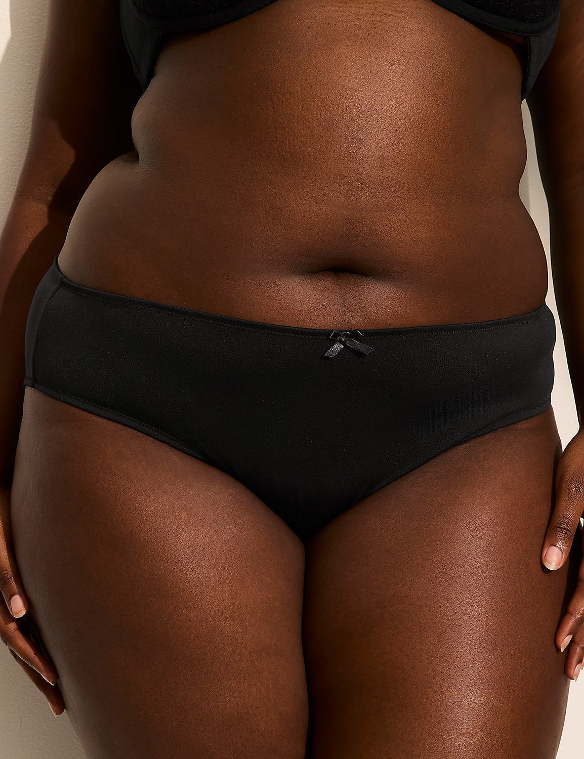 A close-up of a person's buttocks in black lingerie with a fluffy white tail, set against a plain background. Product Image 2