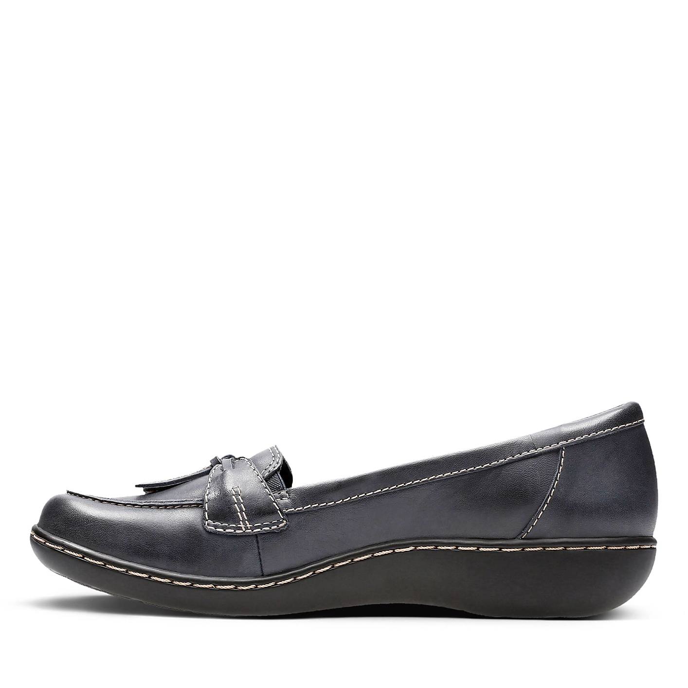 A single navy blue leather loafer with white stitching sits in the foreground against a plain white background. Product Image 2