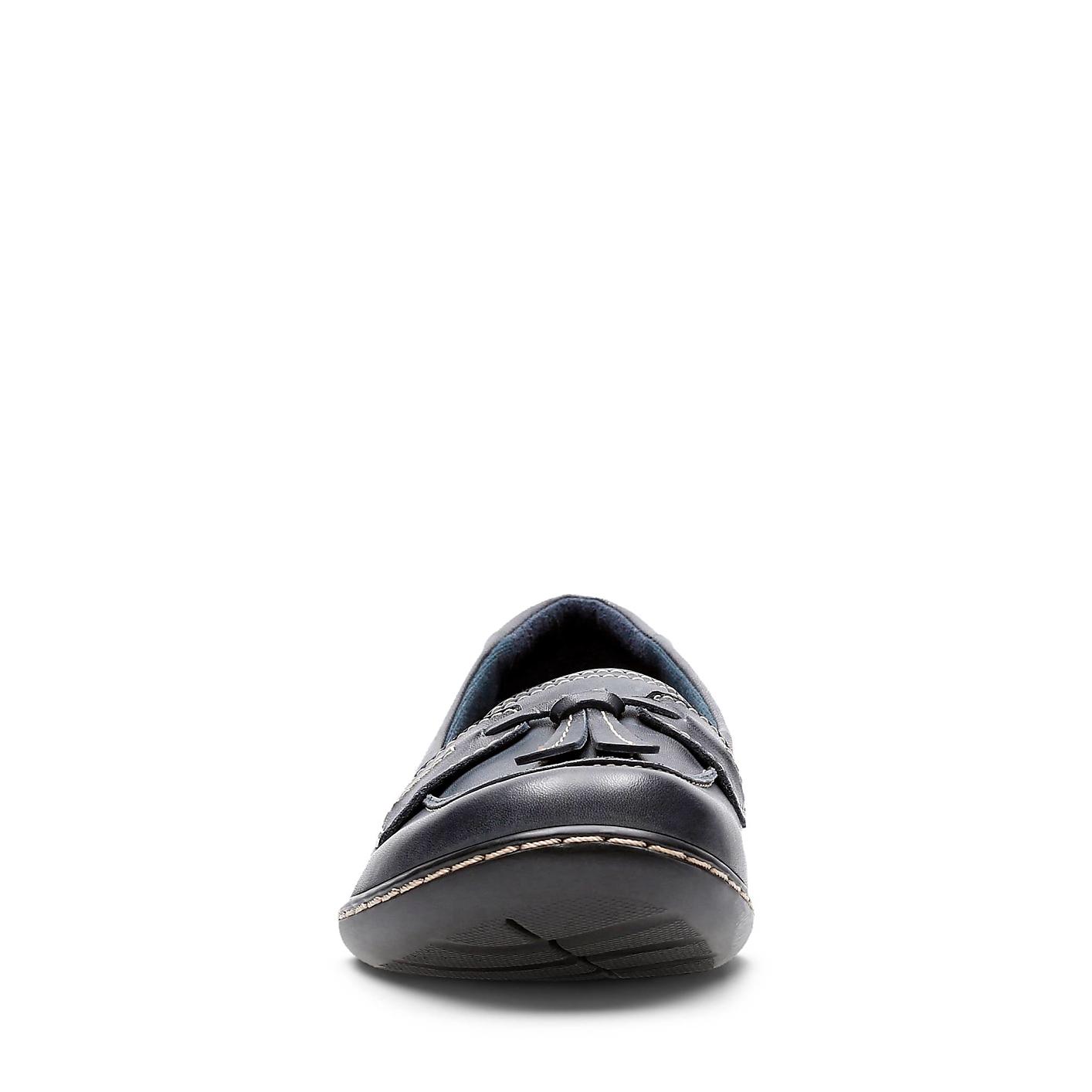 A single navy blue loafer sits in the foreground against a plain white background. Product Image 4