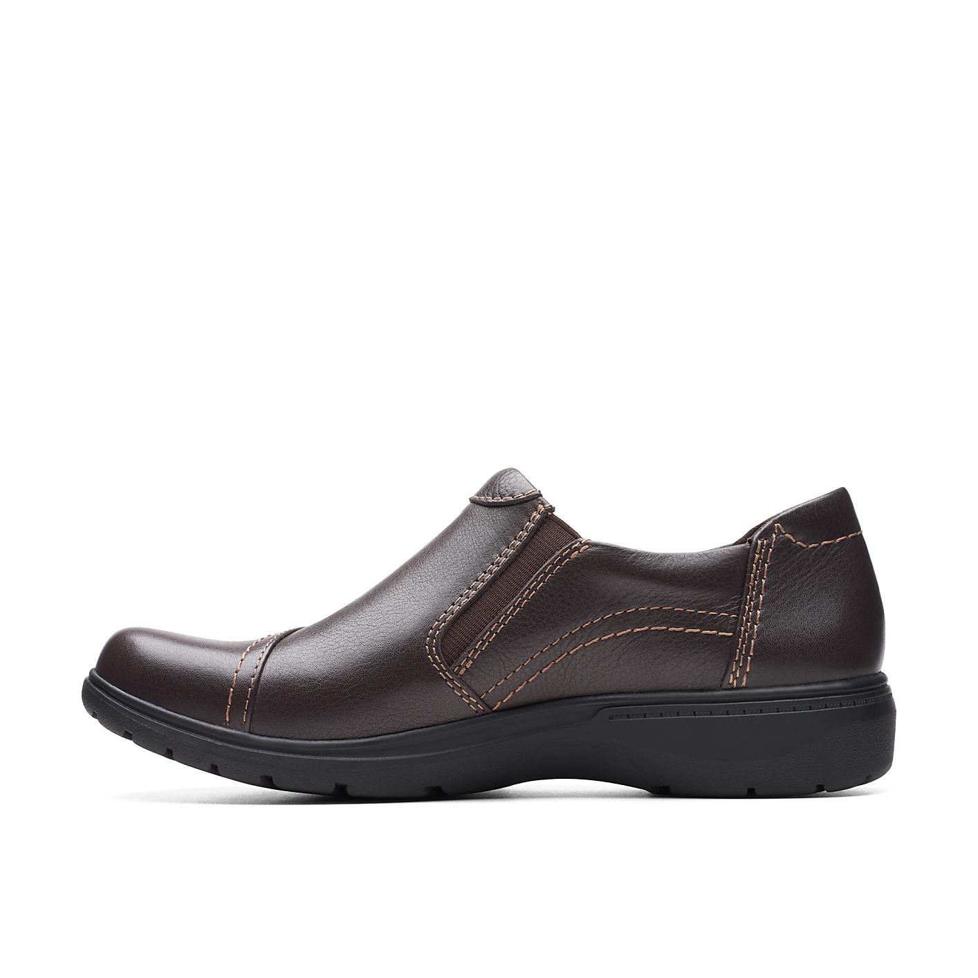 A single brown leather slip-on shoe sits in the foreground against a plain white background. Product Image 3
