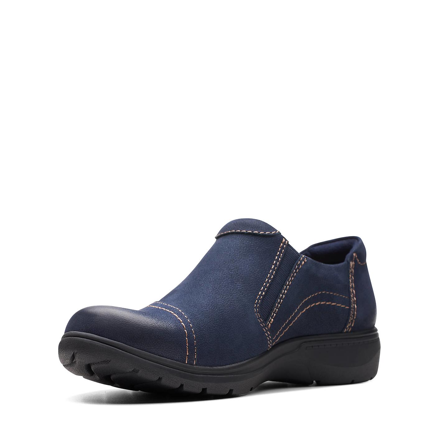 A single navy blue slip-on shoe with contrast stitching sits against a plain white background. Product Image 5