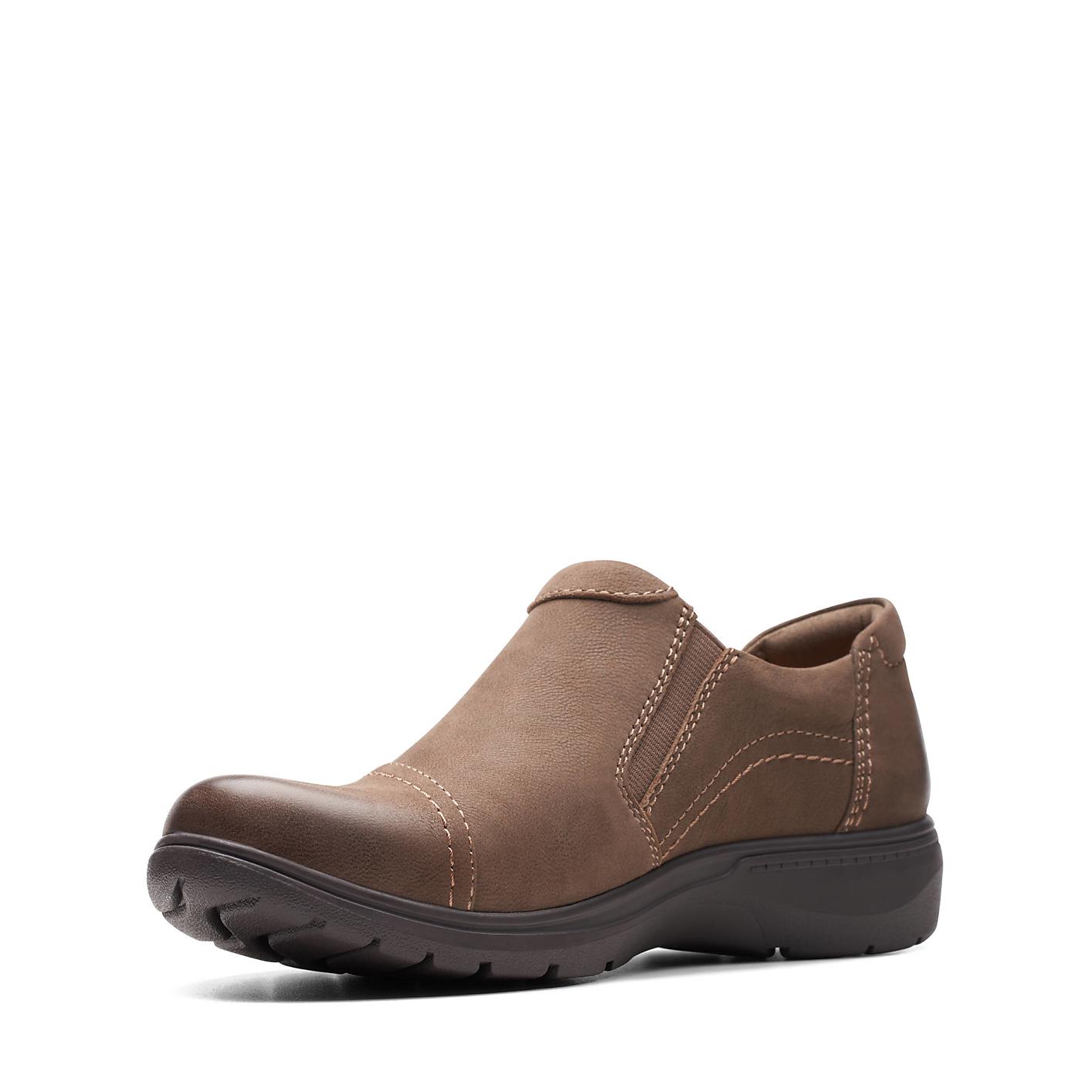 A brown leather slip-on shoe sits centered against a plain white background. Product Image 5