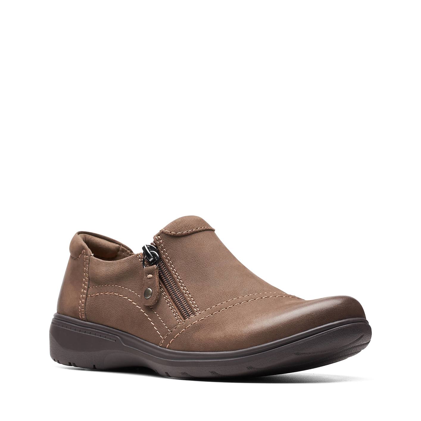 A brown leather slip-on shoe with a side zipper sits in the foreground against a plain white background. Product Image 3