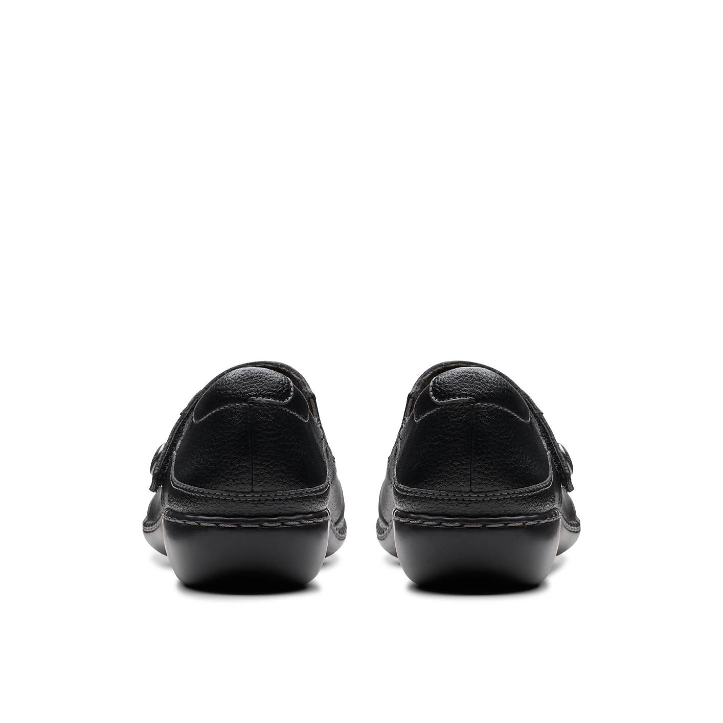 A pair of black leather loafers are positioned in the foreground against a plain white background. Product Image 2